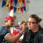 David Gomez painting Tina's face at the Mini Feria