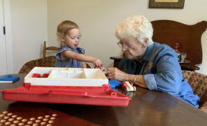 Toddler and her Nana playing with Legos.